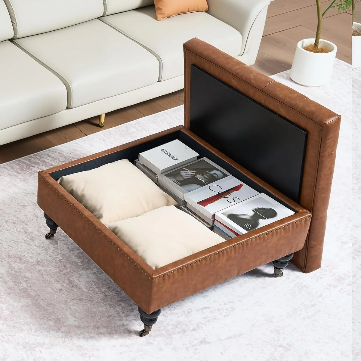 Square leather footstool with storage function, coffee table-style footstool with soft padded raised buttons, equipped with wheels, polyurethane leather high-density sponge, suitable room, dormitory, bedroom, in brown color scheme.